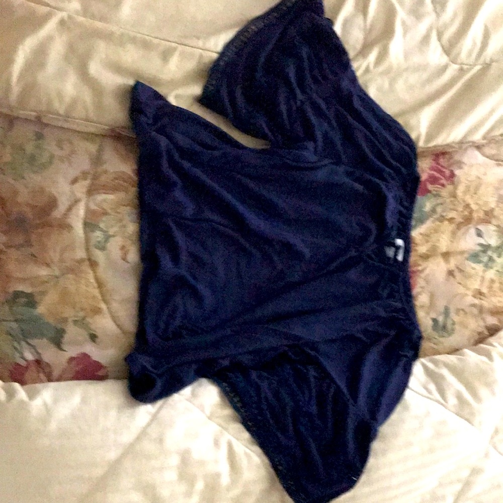 It is a short sleeve royal blue blouse for kids